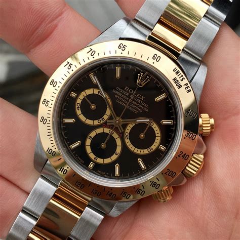 rolex daytona gold black|Rolex gold daytona price.